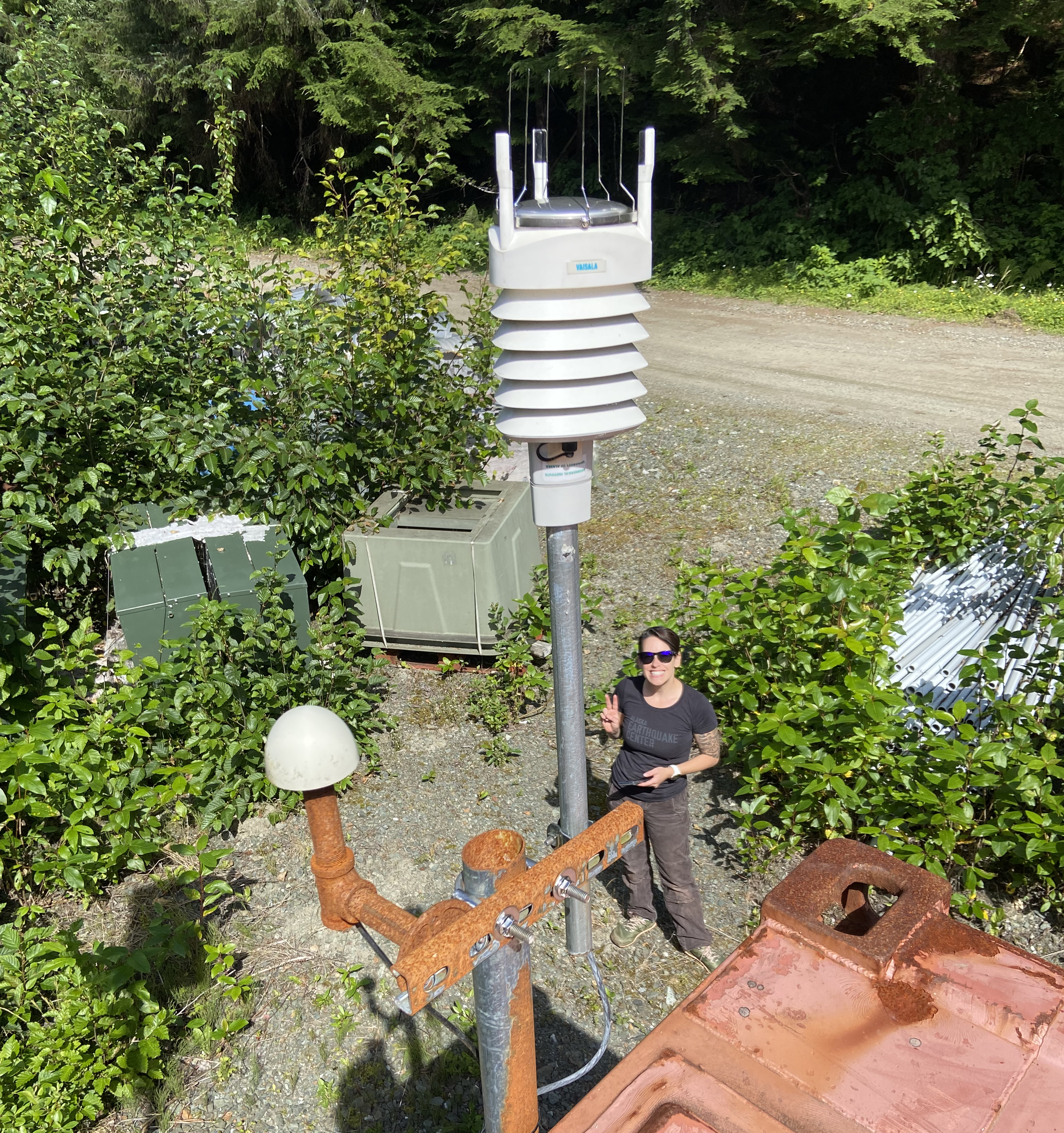 Closeup of weather instrument with person in the background.